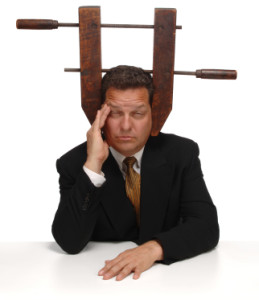 Businessman with a vice on his head